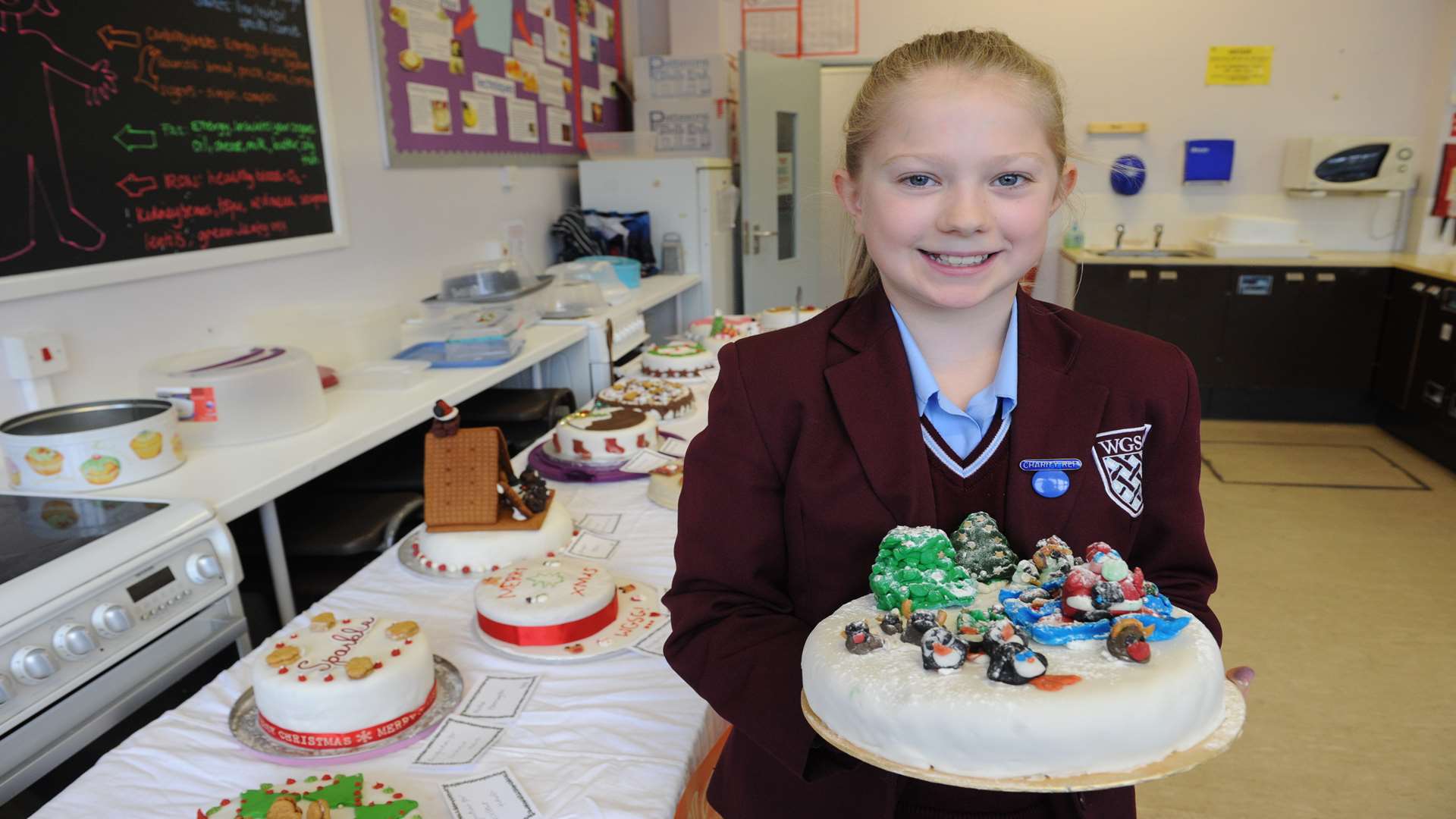 Emily, 12, with her cake