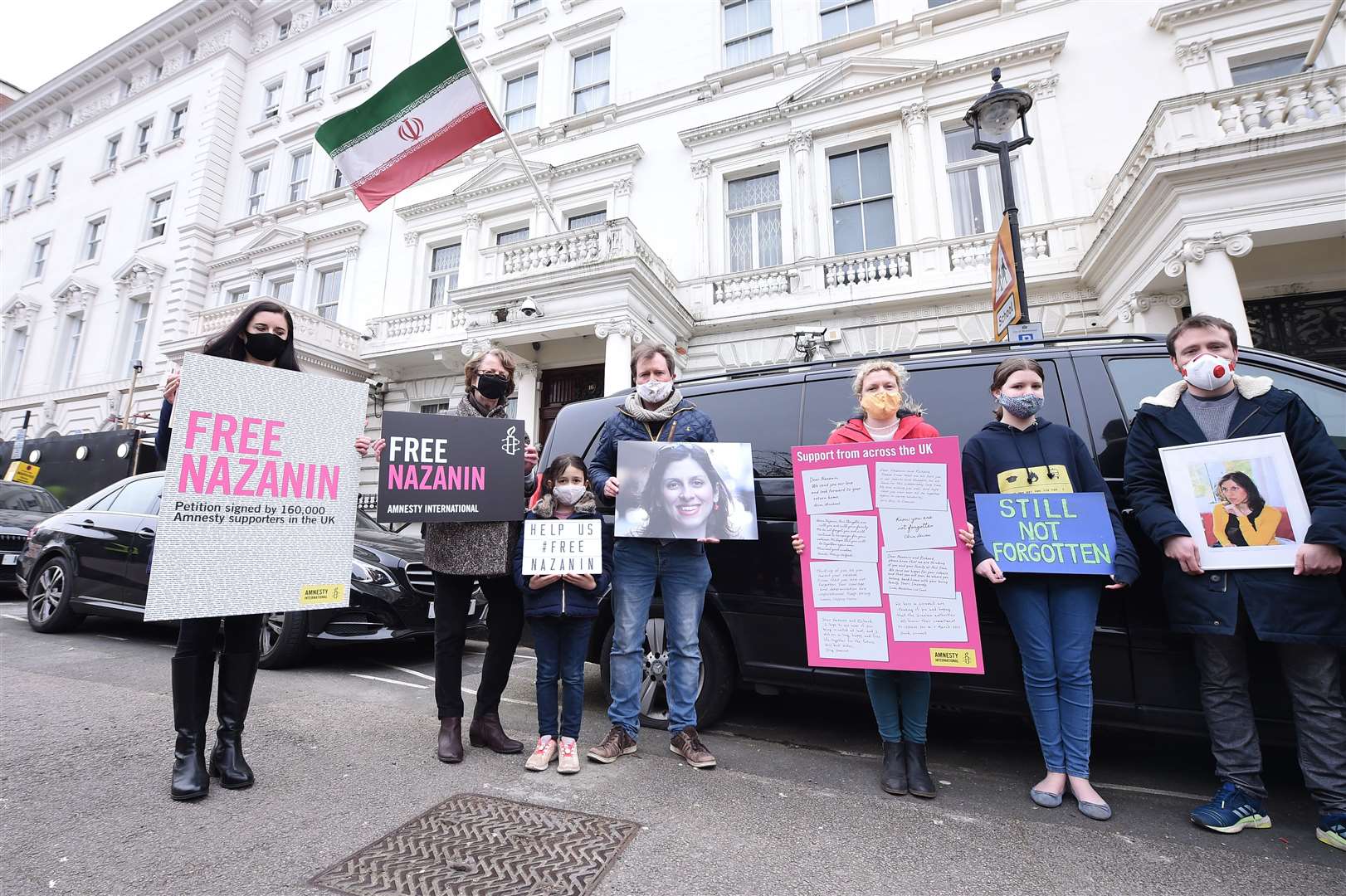 Mr Ratcliffe is seen protesting outside of the Iranian Embassy with his daughter Gabriella and Kate Allen from Amnesty International earlier this year. (Ian West/PA)