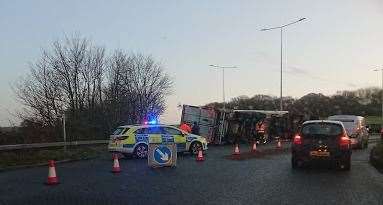 A lorry has overturned near the roundabout