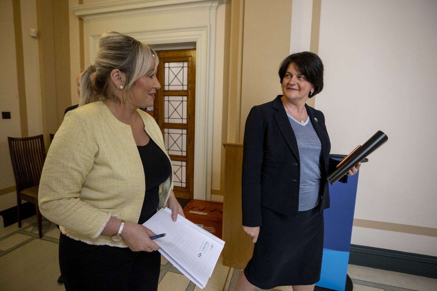 First Minster Arlene Foster (right) and Deputy First Minister Michelle O’Neill chat after appearing at a NI Executive press conference (Liam McBurney/PA)