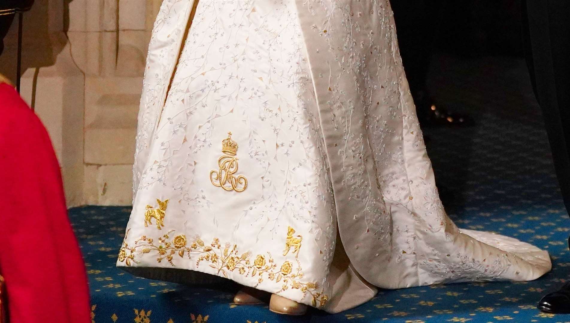 The Queen’s coronation dress featured embroidered motifs of her pet dogs and the names of her grandchildren (Victoria Jones/PA)