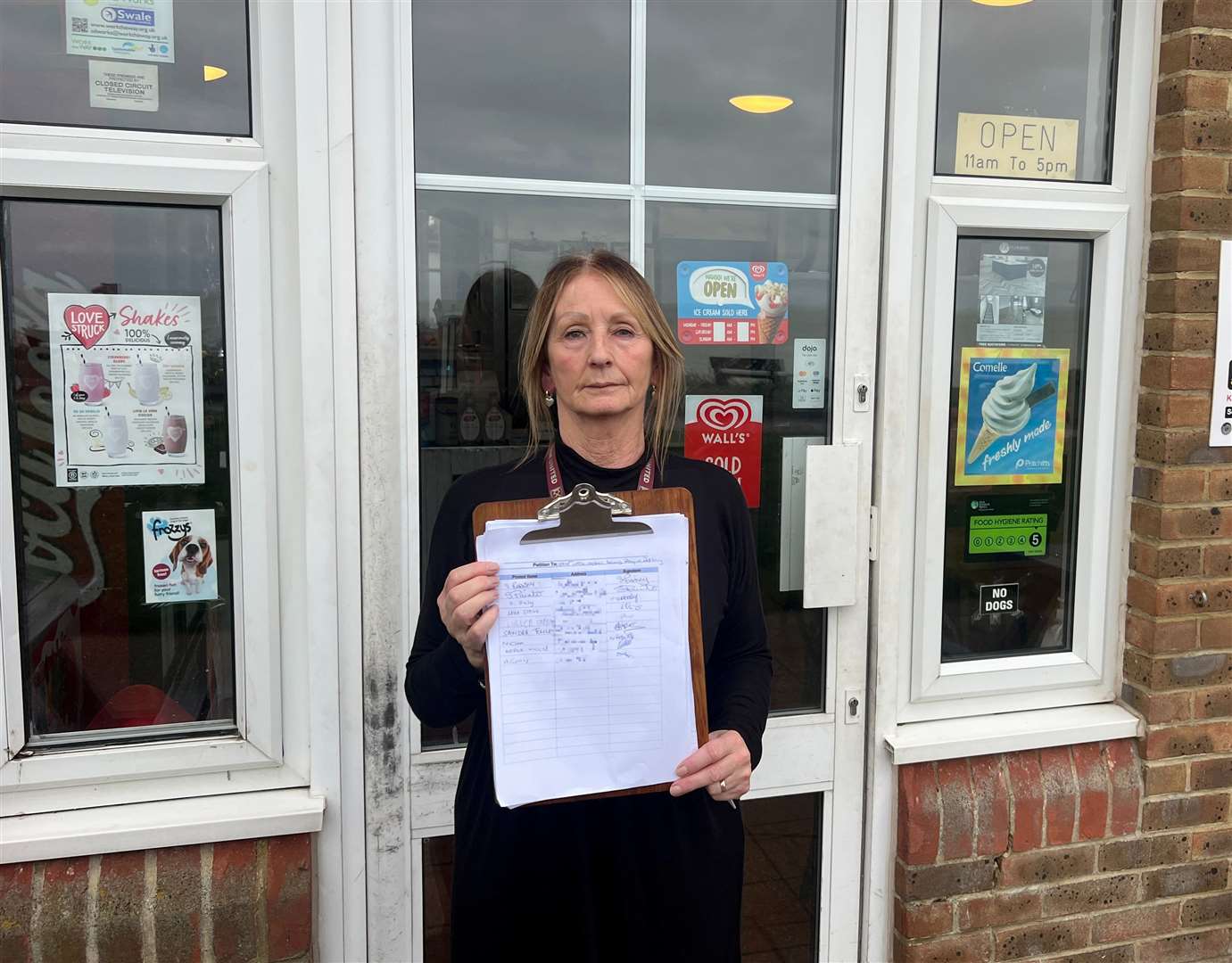 Marilyn Ward with the petition outside the Little Oyster Tea Room. Picture: Megan Carr