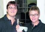 Paula Gunnell and guide Christine Hewitt try on their sponsor's tee shirts