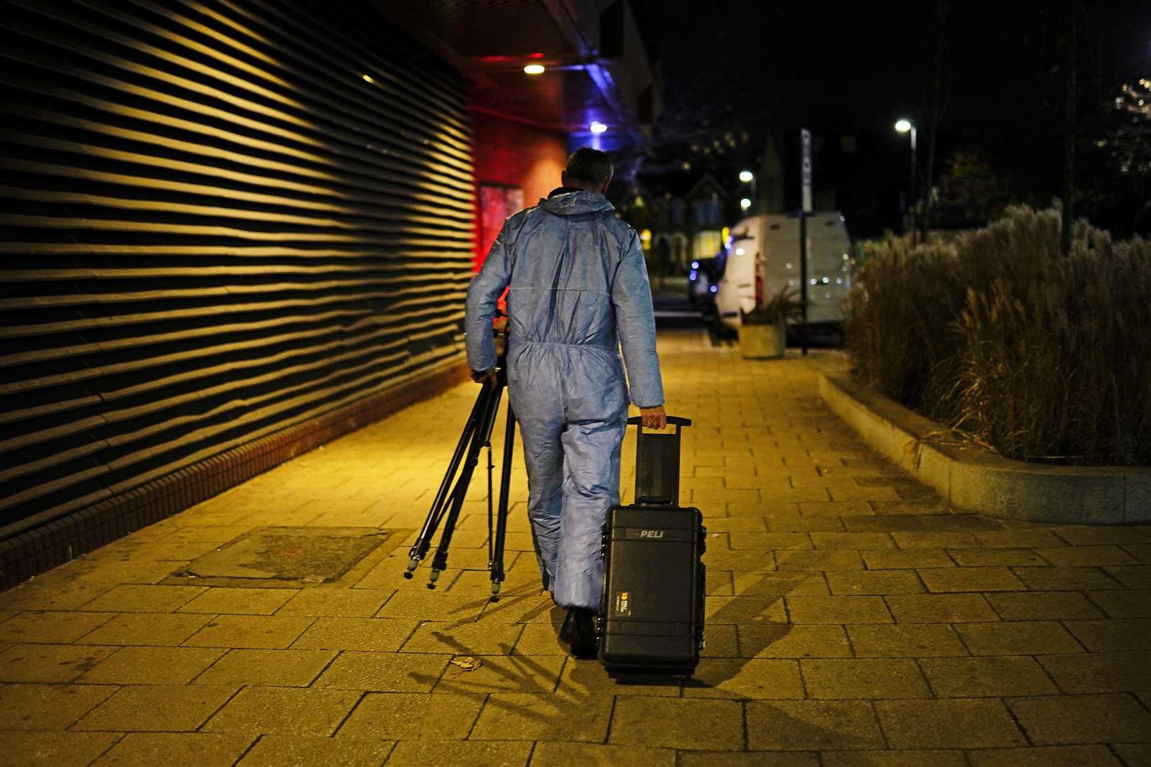 A forensic officer near the scene in Mayes Road, Wood Green, north London (Aaron Chown/PA)