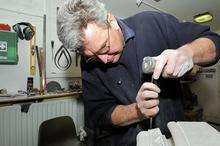 Stone mason Ian Gartside from Canterbury works on a piece of stone that will be used to repair the Cathedral.