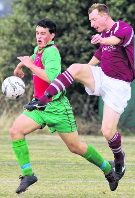 Canterbury, purple, crashed out of the Weald of Kent Charity Cup at Hersden after two late goals