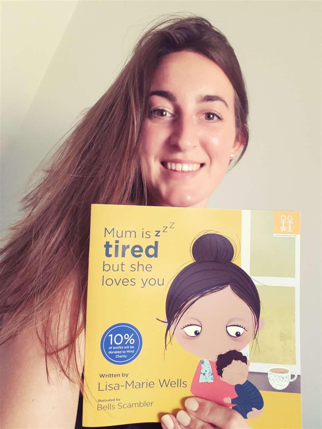 Lisa-Marie Wells with her book 'Mum is tired but she loves you' Picture: Lisa-Marie Wells