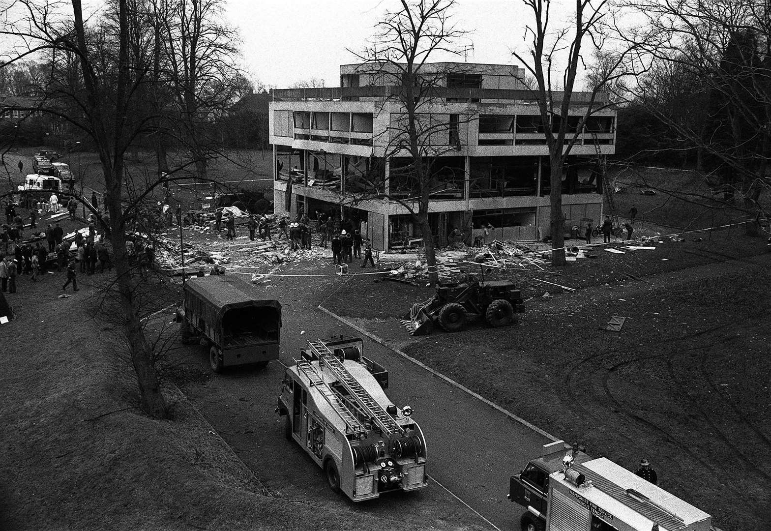 The front of the glass-panelled officers’ mess ripped out and cars were wrecked when the car packed with explosives detonated (PA)