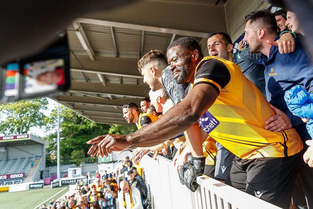 George Elokobi leads last season's National South title celebrations. Picture: Helen Cooper