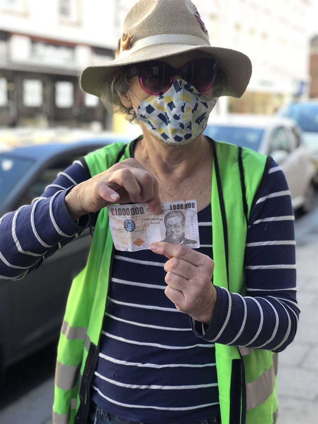 Volunteer litter picker Beryl Payne, with her extraordinary find, a one million pound note