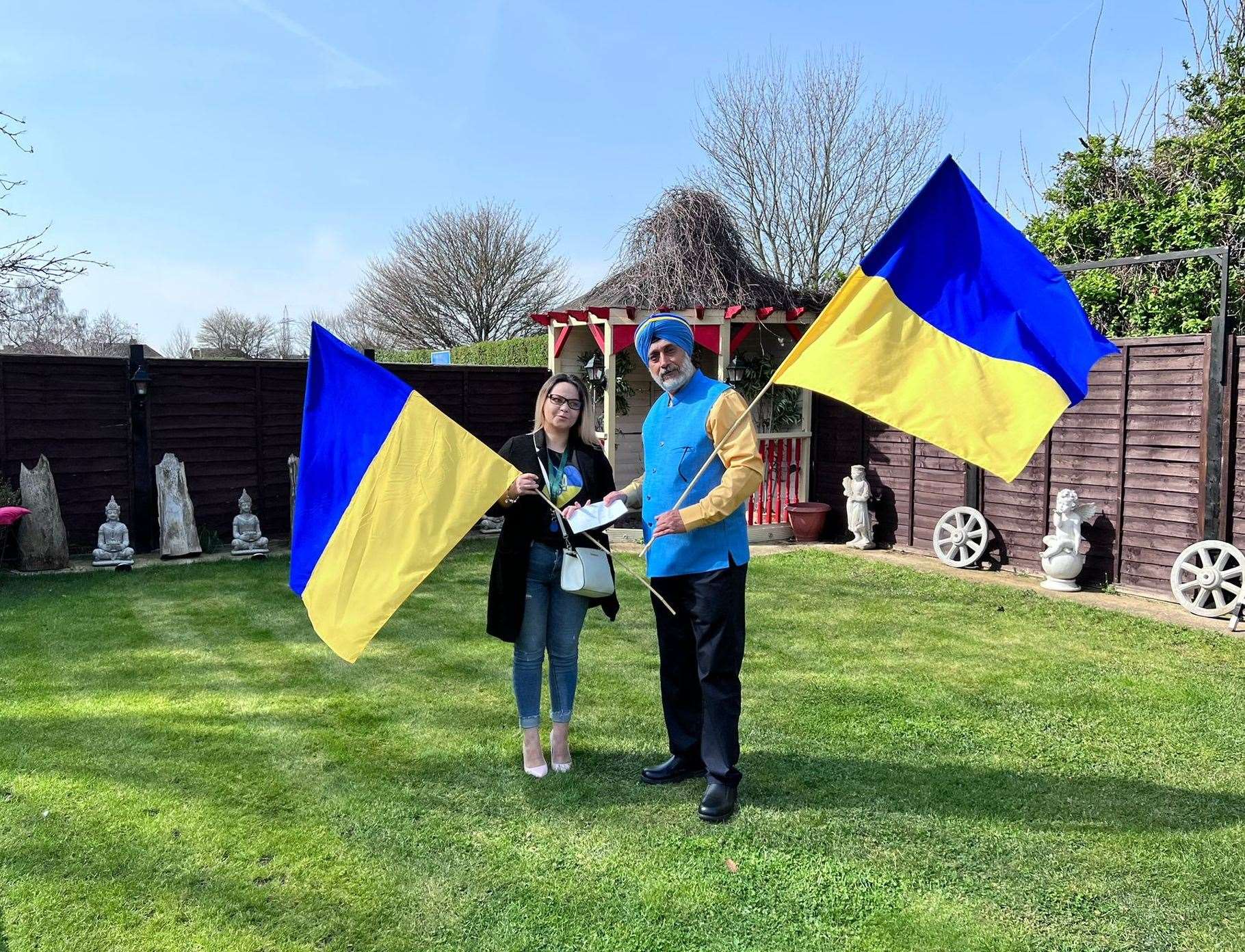 Andy Singh collecting a donation from Oksana, a Ukrainian national living in Gravesend.