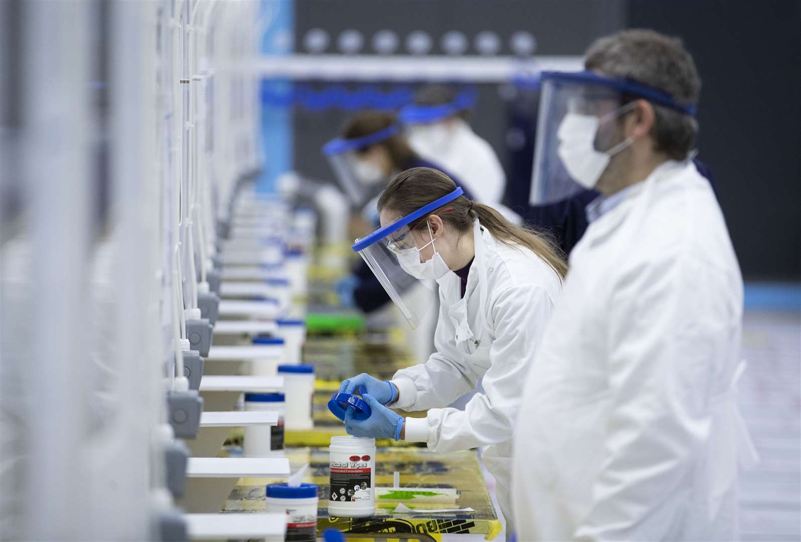 Medical students at work in the Covid-19 mass testing centre (Jane Barlow/PA)