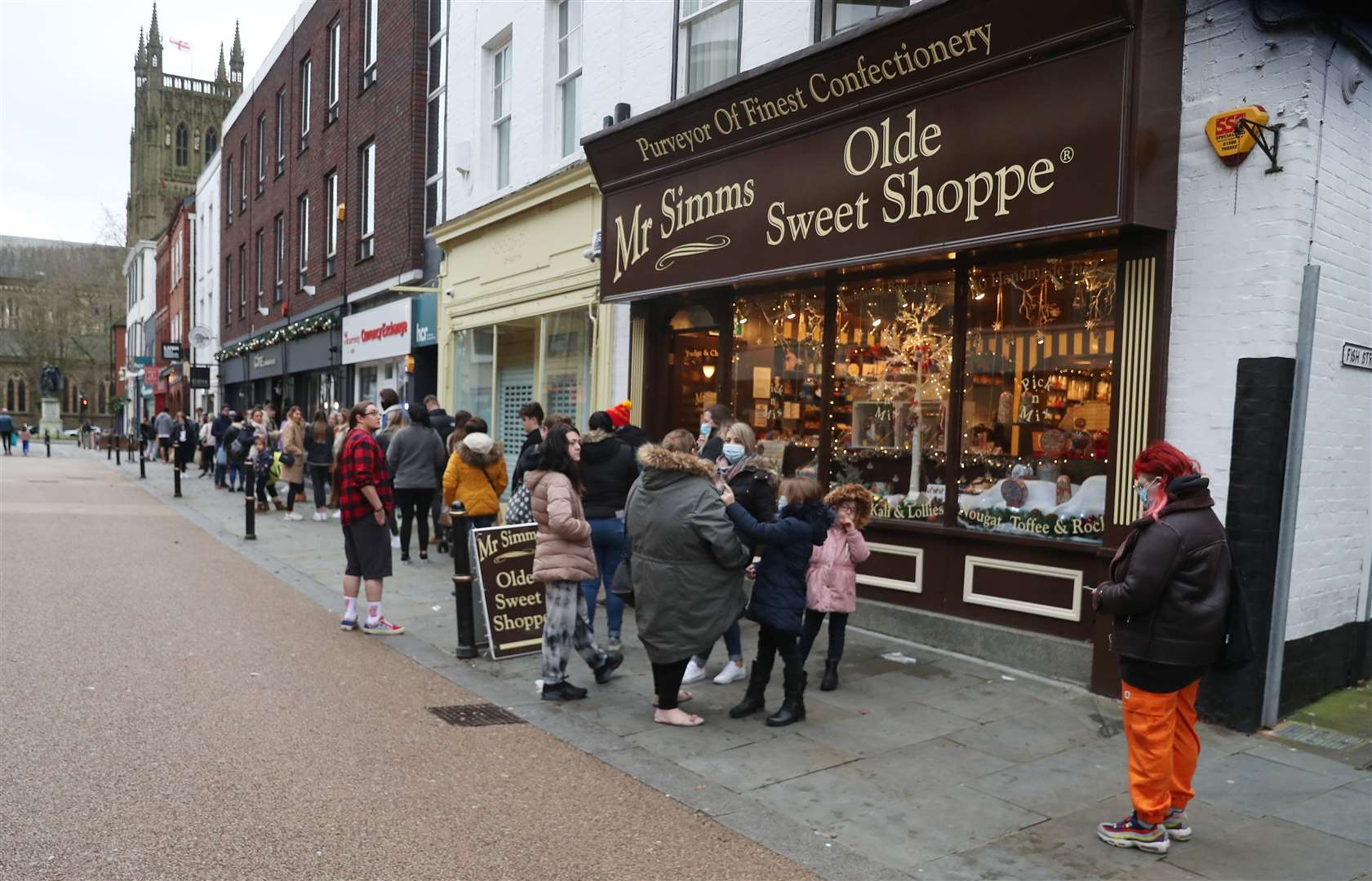 Shoppers queue to get into Lush in Worcester during the Boxing Day sales (David Davies/PA)