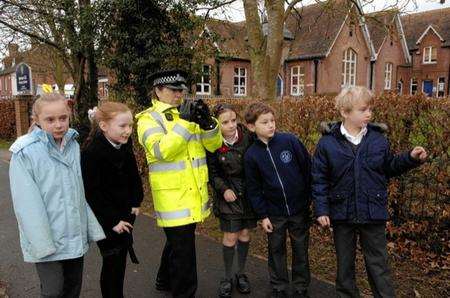 Pupils from year5 at Barham School join P.C. Karen Robson on speed check duty outside their school.