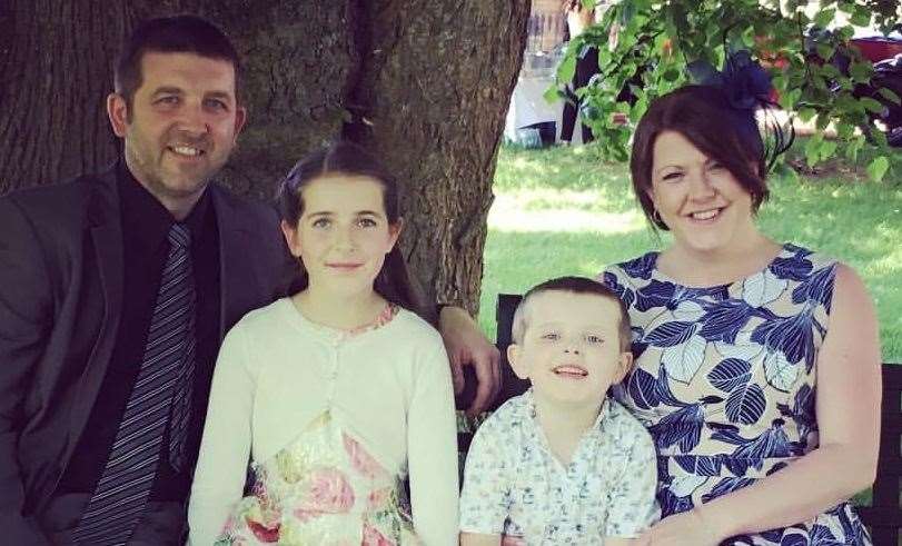 Joe with dad Michael, sister Lucy and mum Becky