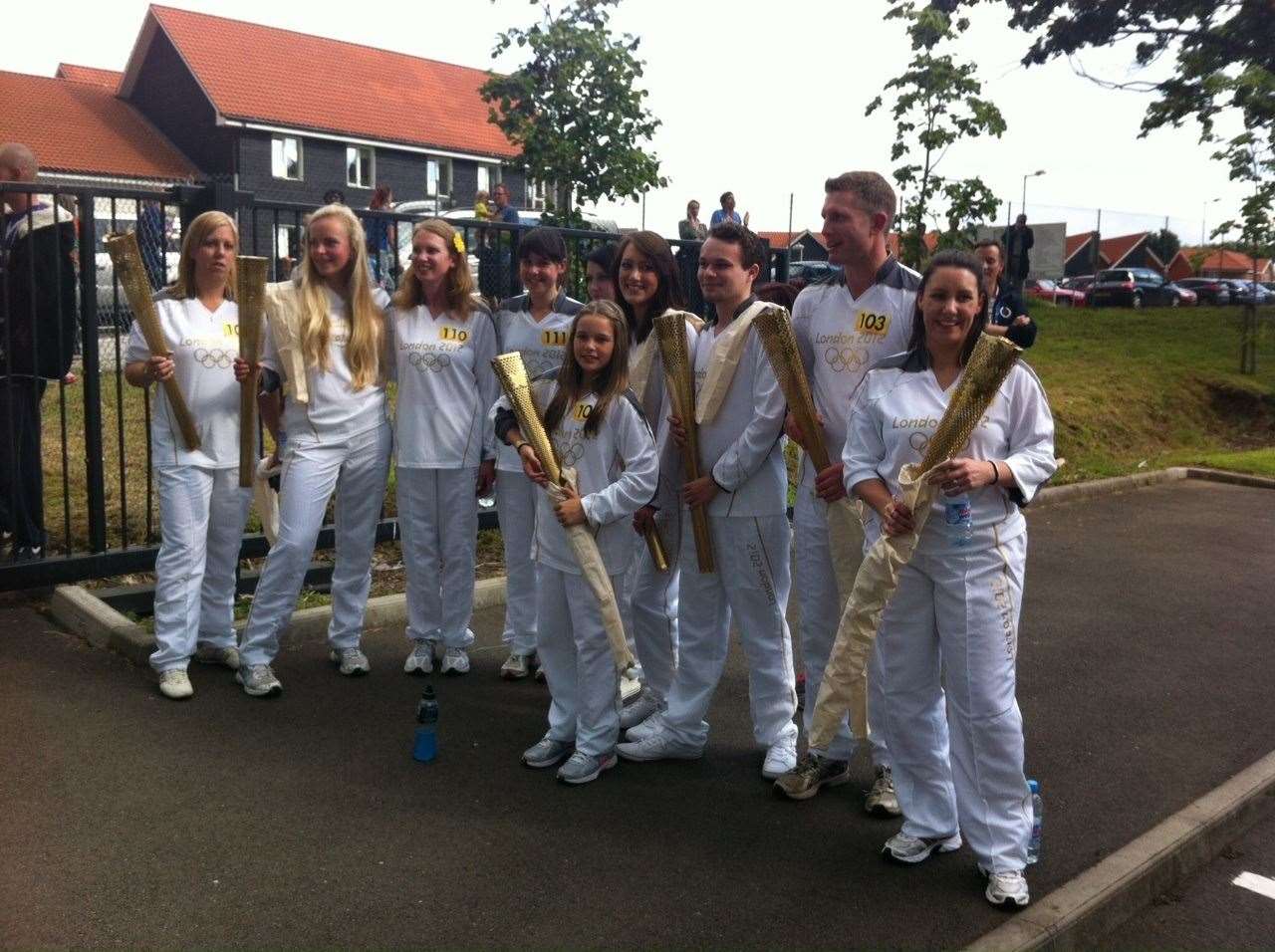 Homewood School pupil Ella Barnes (centre) with fellow Canterbury torchbearers after the relay. Pic: Joanne Barnes