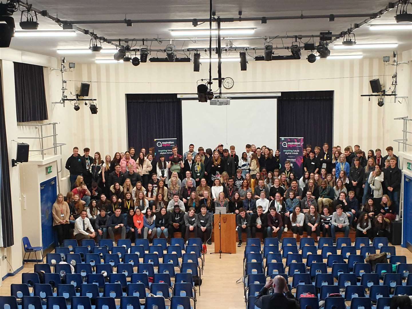 The audience at the school are pictured with guest speakers at the event