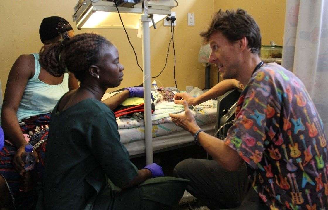 Mr Bryant with patients at ELWA Hospital in Liberia (Swansea Bay UHB/Mikey Bryant/PA)