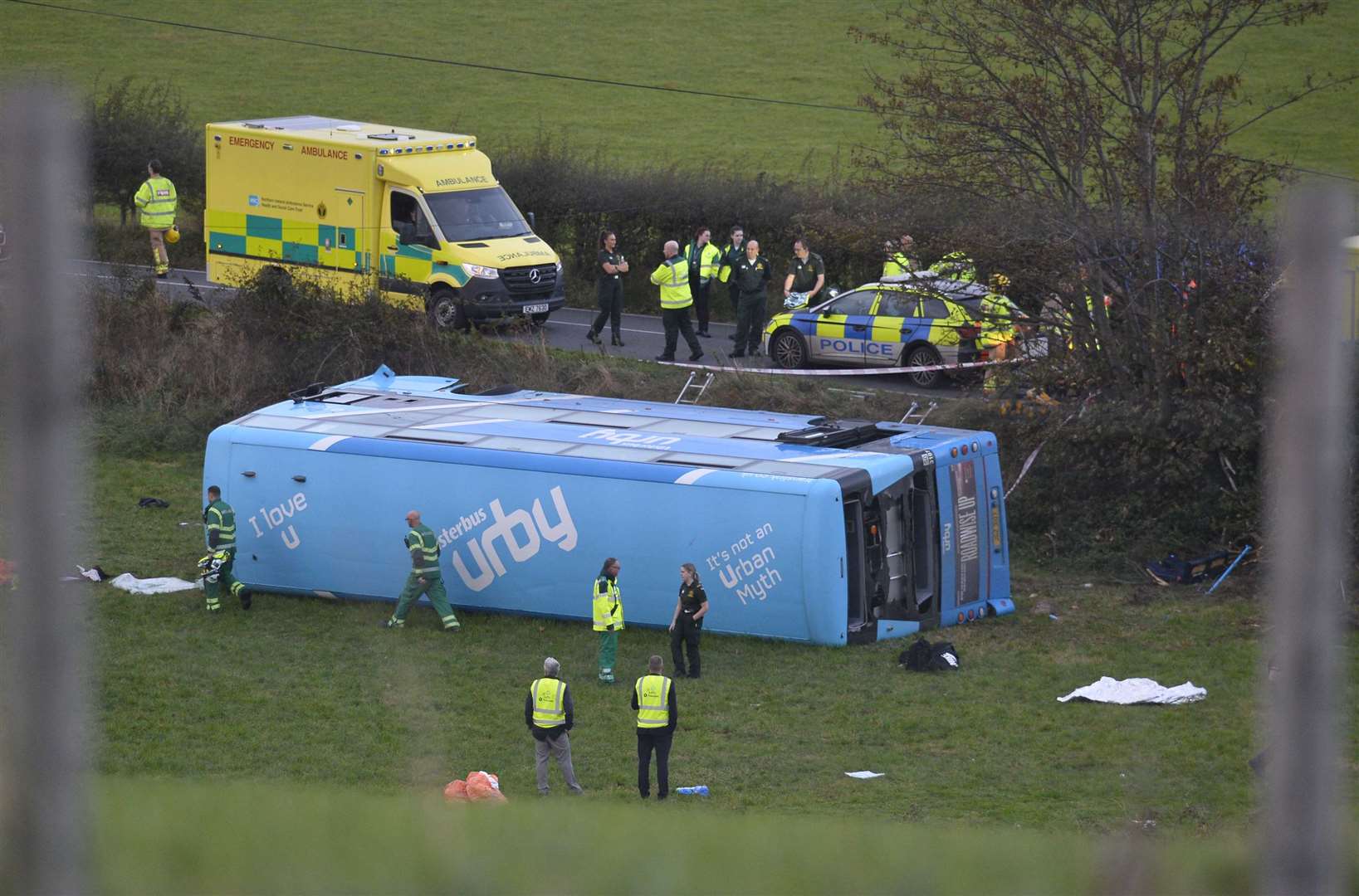 The double-decker bus carrying 43 pupils overturned in a field near Carrowdore, Co Down, on Monday (Mark Marlow/PA)