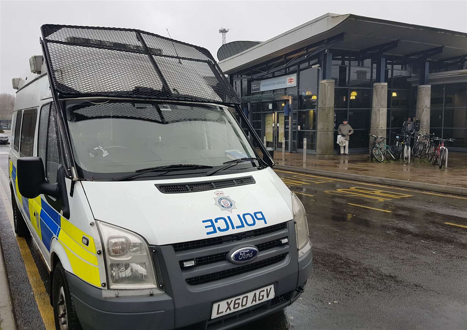 A police van is currently parked outside Ashford International station