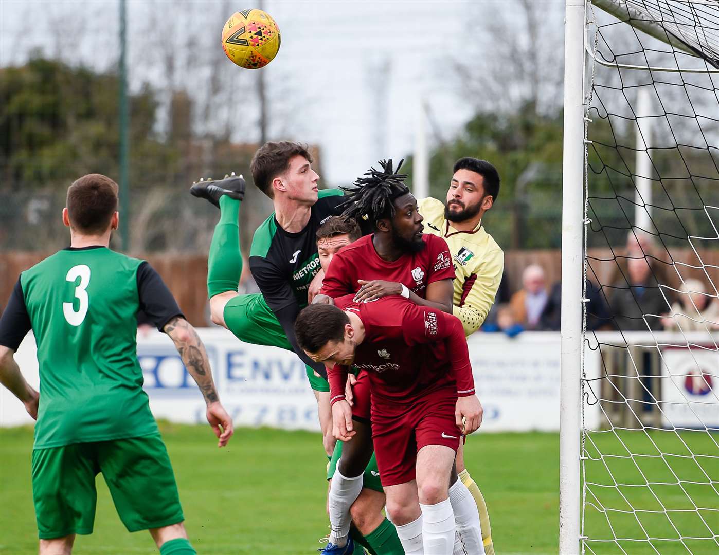 Cray Valley keeper Deren Ibrahim punches clear under pressure from one of Ryan Cooper's long throws Picture: Alan Langley