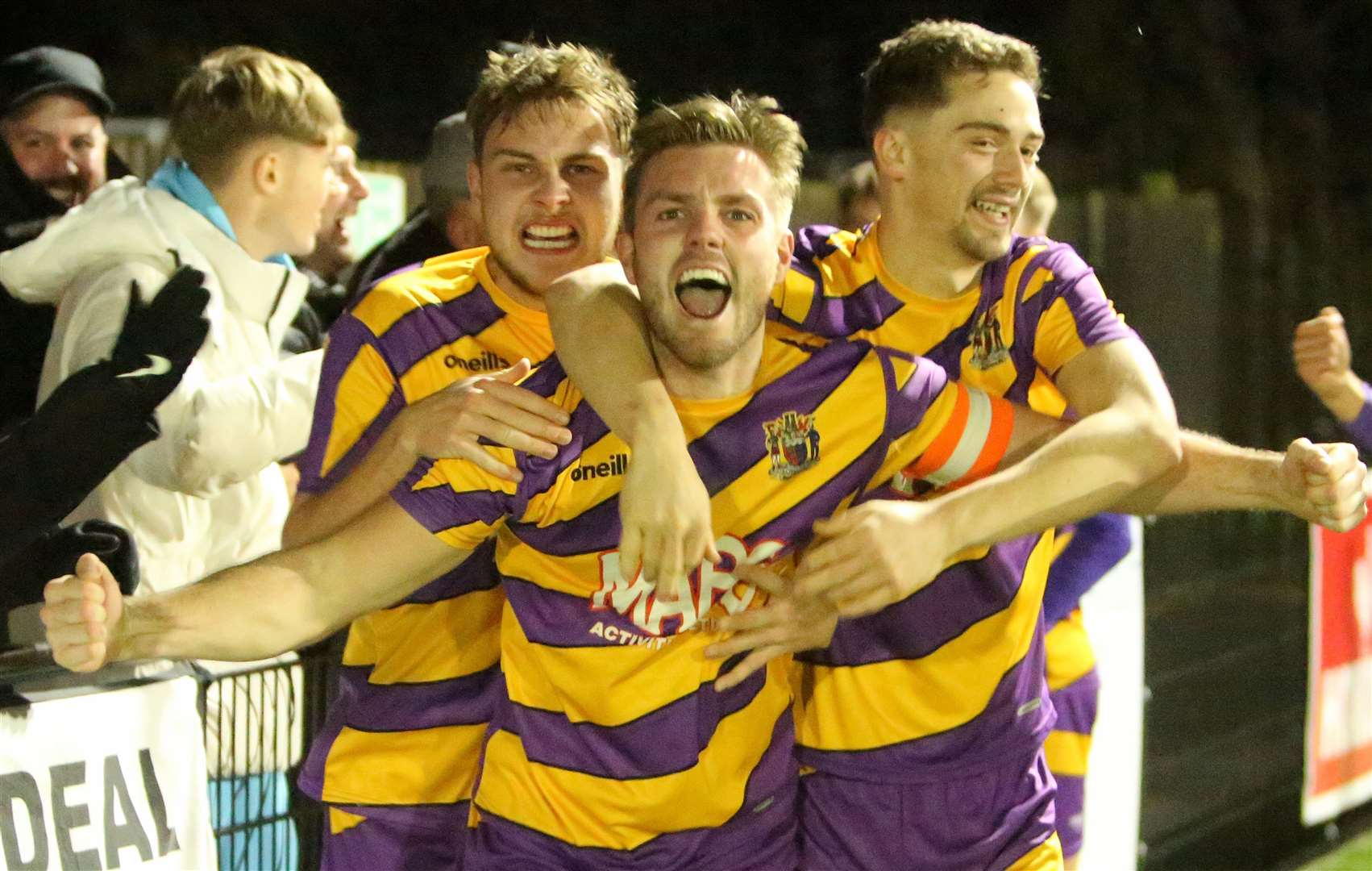 Aaron Millbank celebrates scoring for Deal with team-mates Billy Munday and substitute Jack Hanson. Picture: Paul Willmott