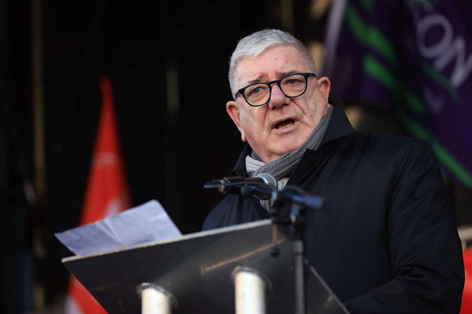 Gerry Murphy, assistant general secretary of the Irish Congress of Trade Unions, addresses union members outside Belfast City Hall (Liam McBurney/PA)