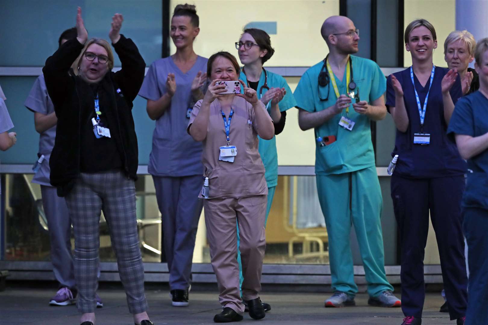 The Queen has described the applause for care and essential workers – being observed here by staff from the Royal Liverpool University Hospital – as an “expression of our national spirit”. Peter Byrne/PA Wire