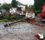 The low loader knocked down a telegraph pole