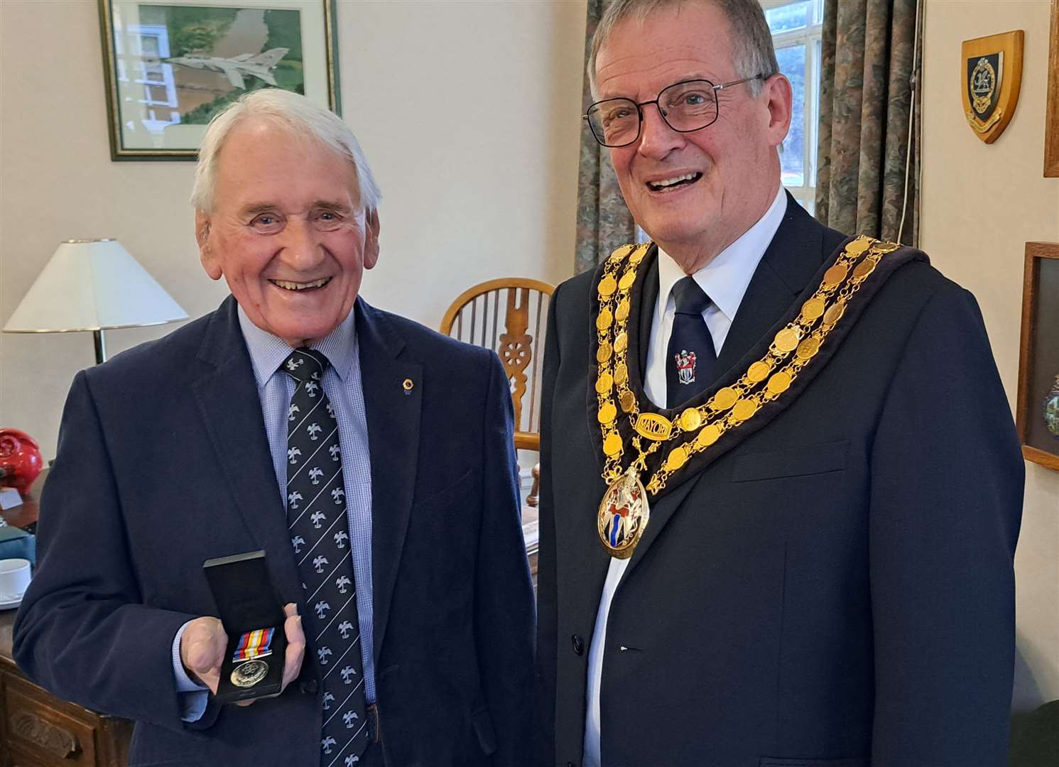 Ian Kury receives his medal from the Mayor, James Lark