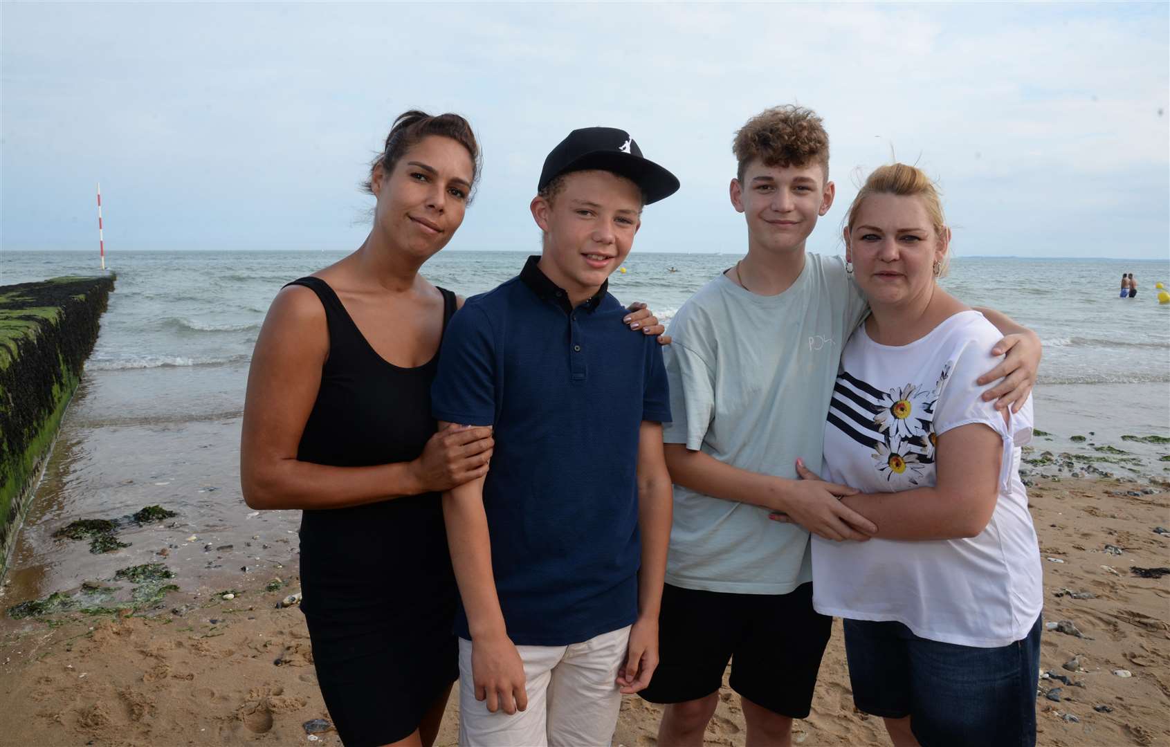 Tyreece Solly, 13 and Cameron Bevis, 14, with mothers Alisia Williams, left, and Sarah Sagir