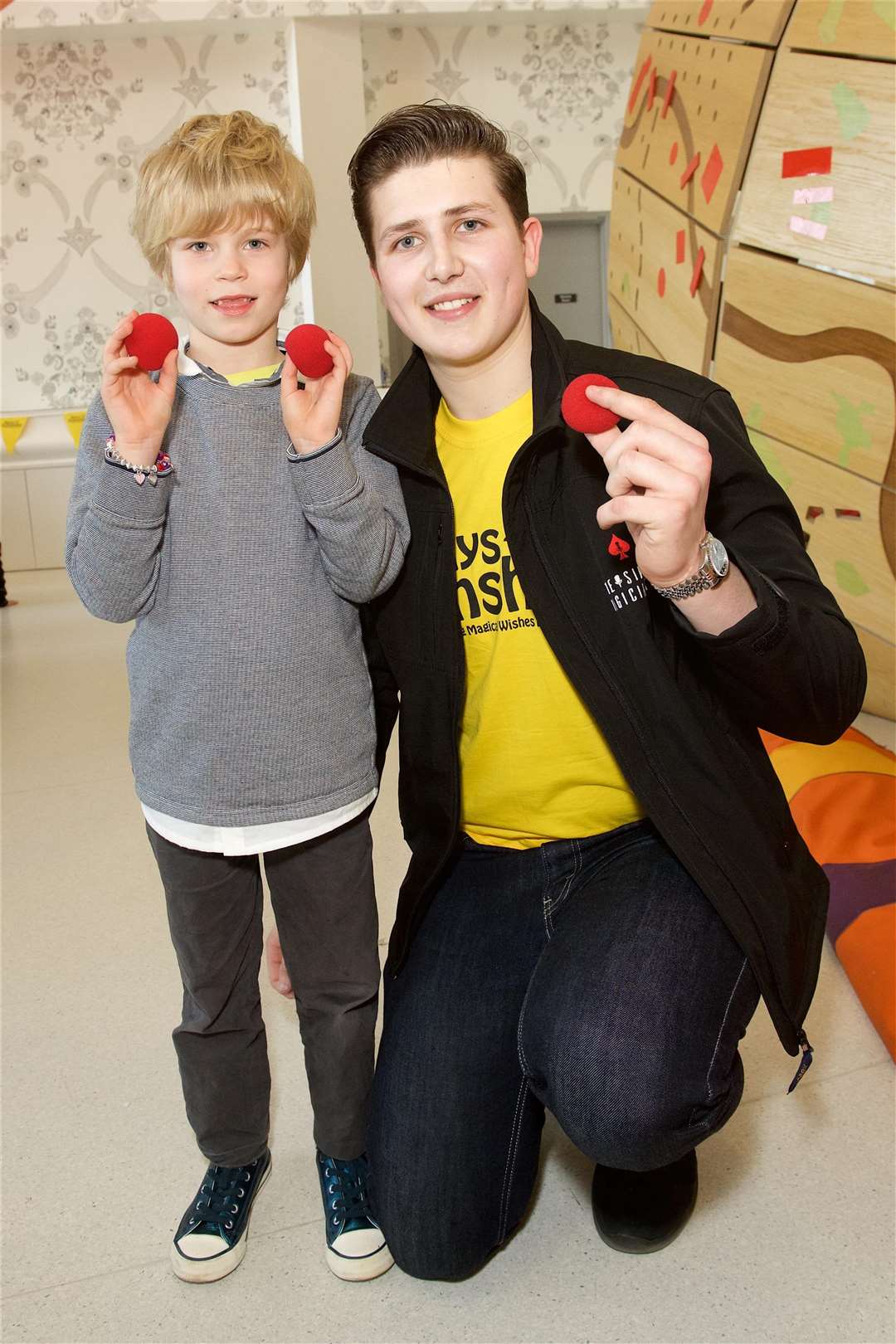 Lewis performs magic tricks for unwell children