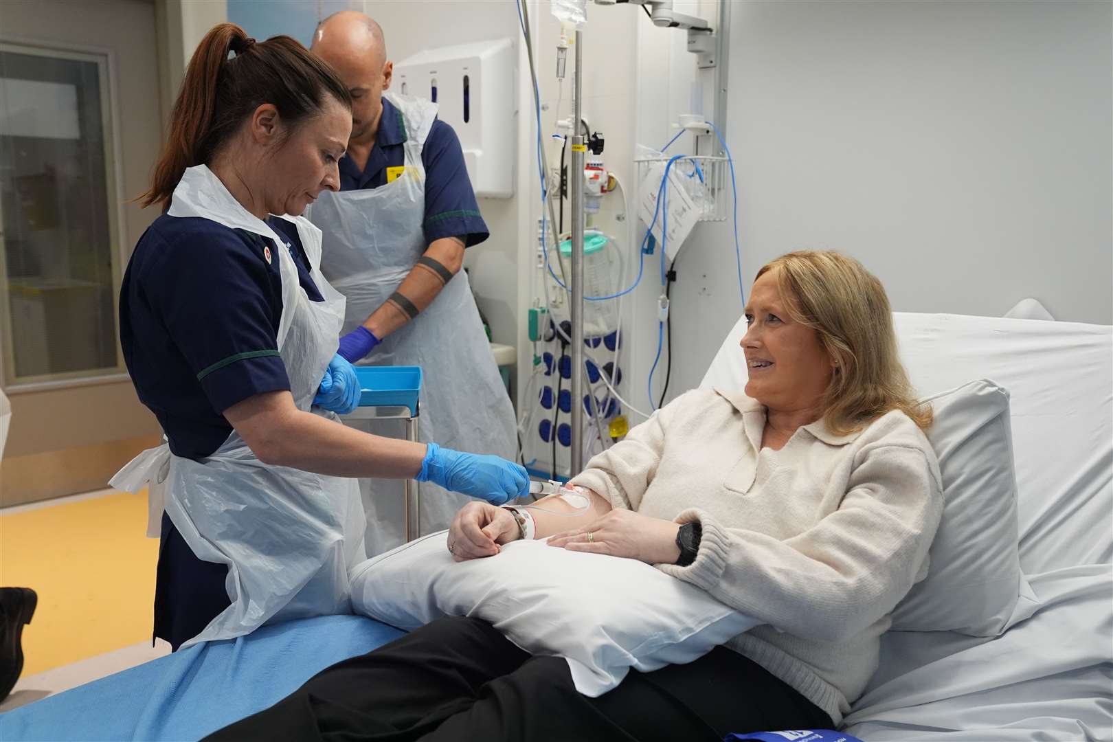 Senior clinical practice facilitator Nicole Prescott administers breakthrough treatment to patient Katie Tinkler for lupus at University College London Hospital in London (Lucy North/PA)