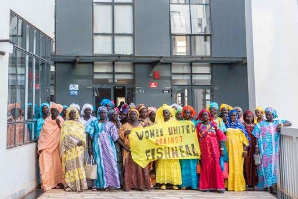 Women working in the fishing industry in Senegal protest against fishmeal production (Pape Diatta Sarr/ Greenpeace)