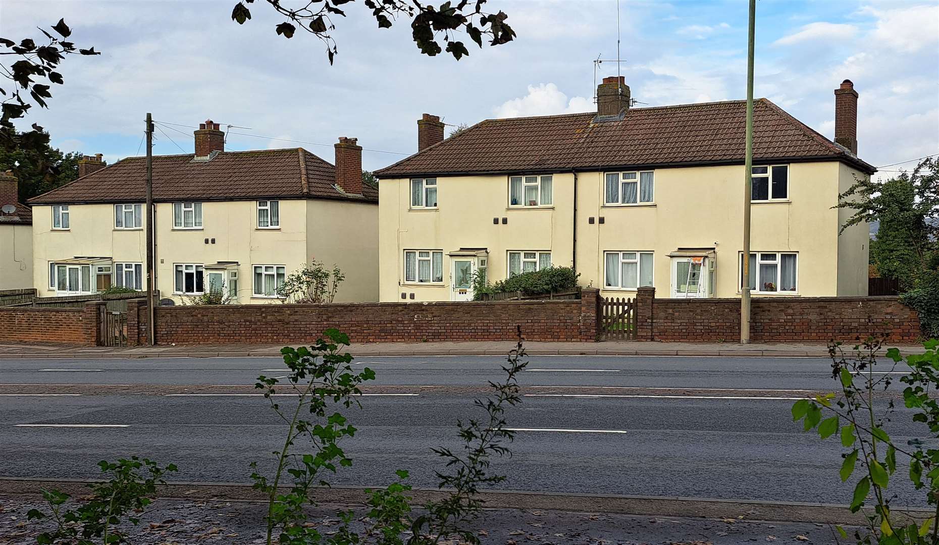 The targeted homes, seen from where the vandals hide