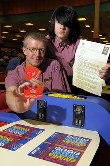 Mecca Bingo staff Jez Dobbie and Lee Walmsley in the Mecca Bingo Hall in High Street, Sittingbourne, with letters from Derek Wyatt MP and protest cards about the proposed new tax levels on bingo.