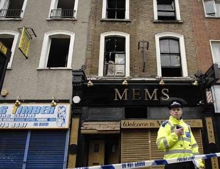 Police outside the fire-damaged building today. Picture: DAVID ANTONY HUNT