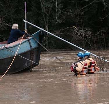 A woman is rescued off a house boat in Maidstone. Picture: Medway Coastgaurd