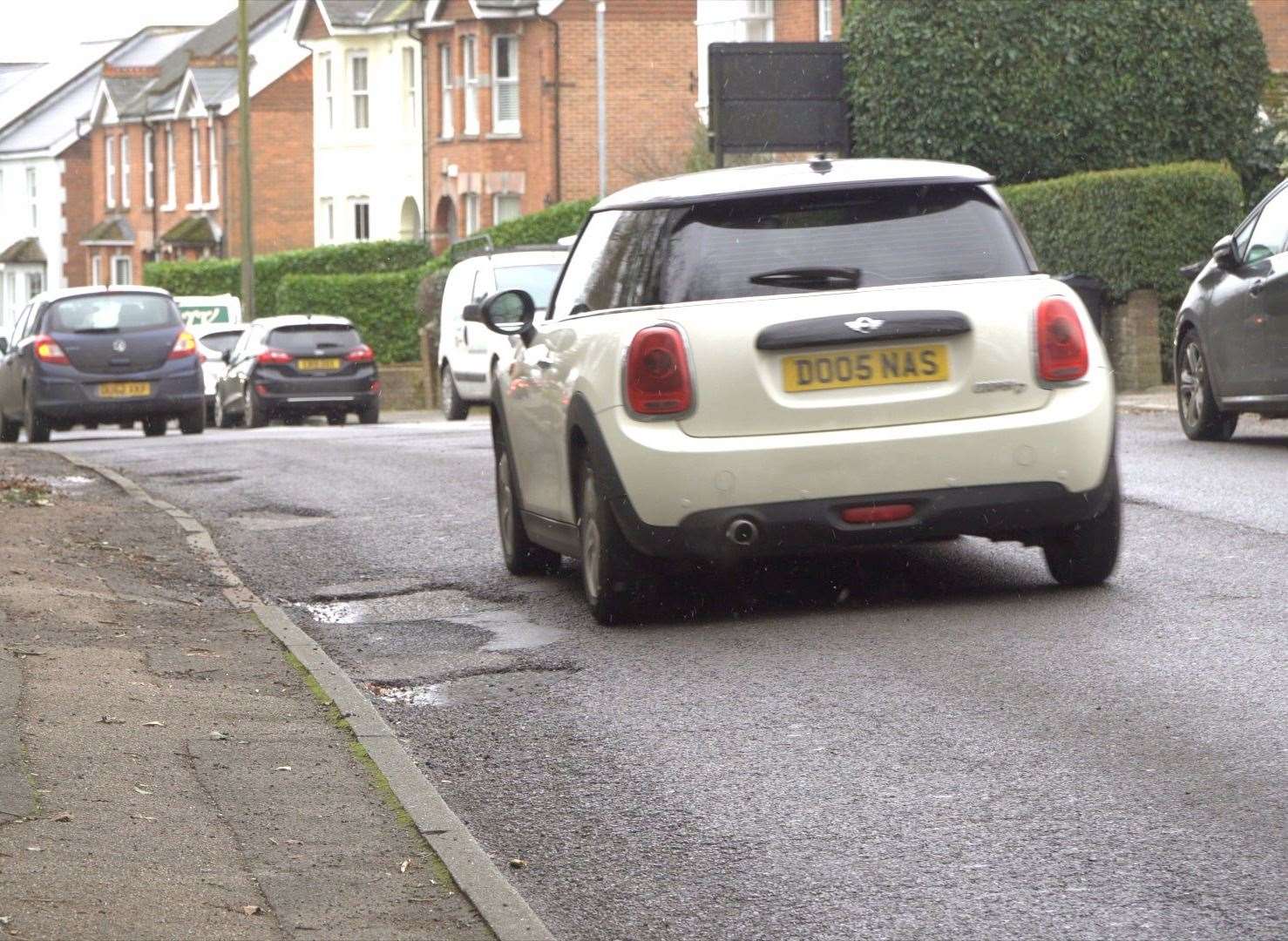 Residents say cars will often swerve to avoid huge craters in the road