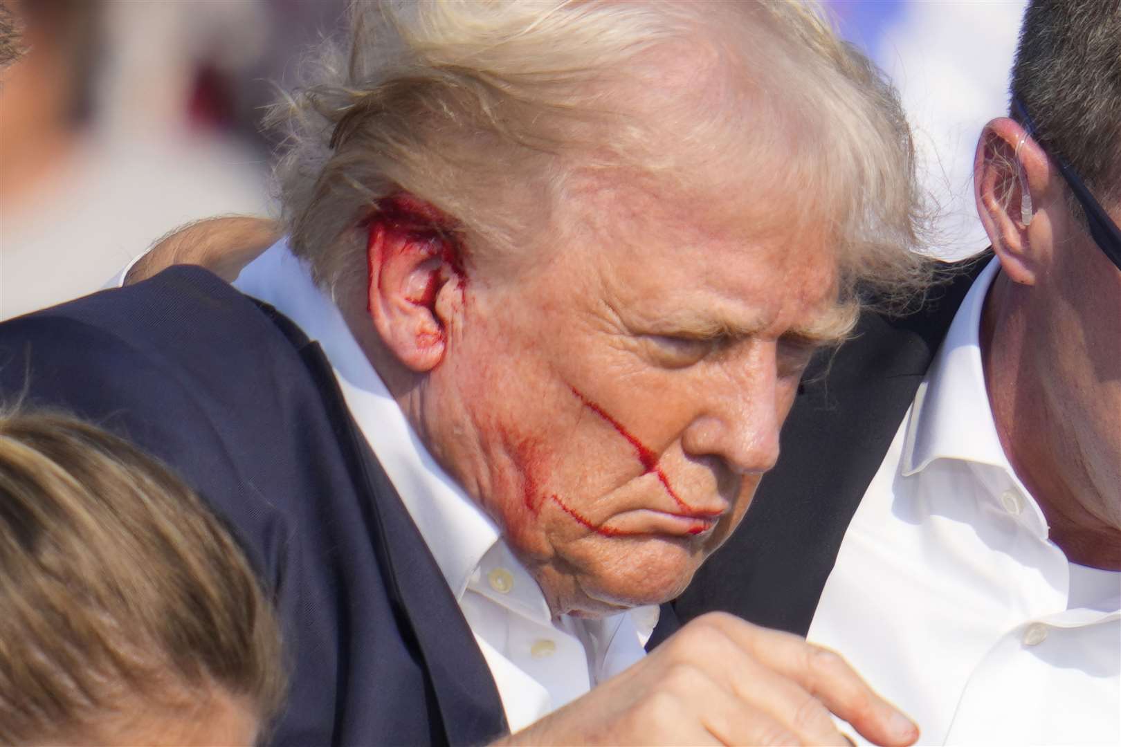 Pictures showed blood on Donald Trump’s right ear and part of his face after shots were fired during the rally (Gene J Puskar/AP)