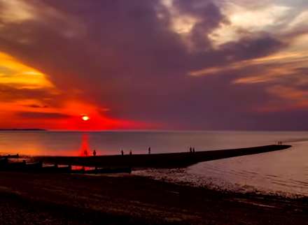 Whitstable sunset shown in time lapse video over The Street