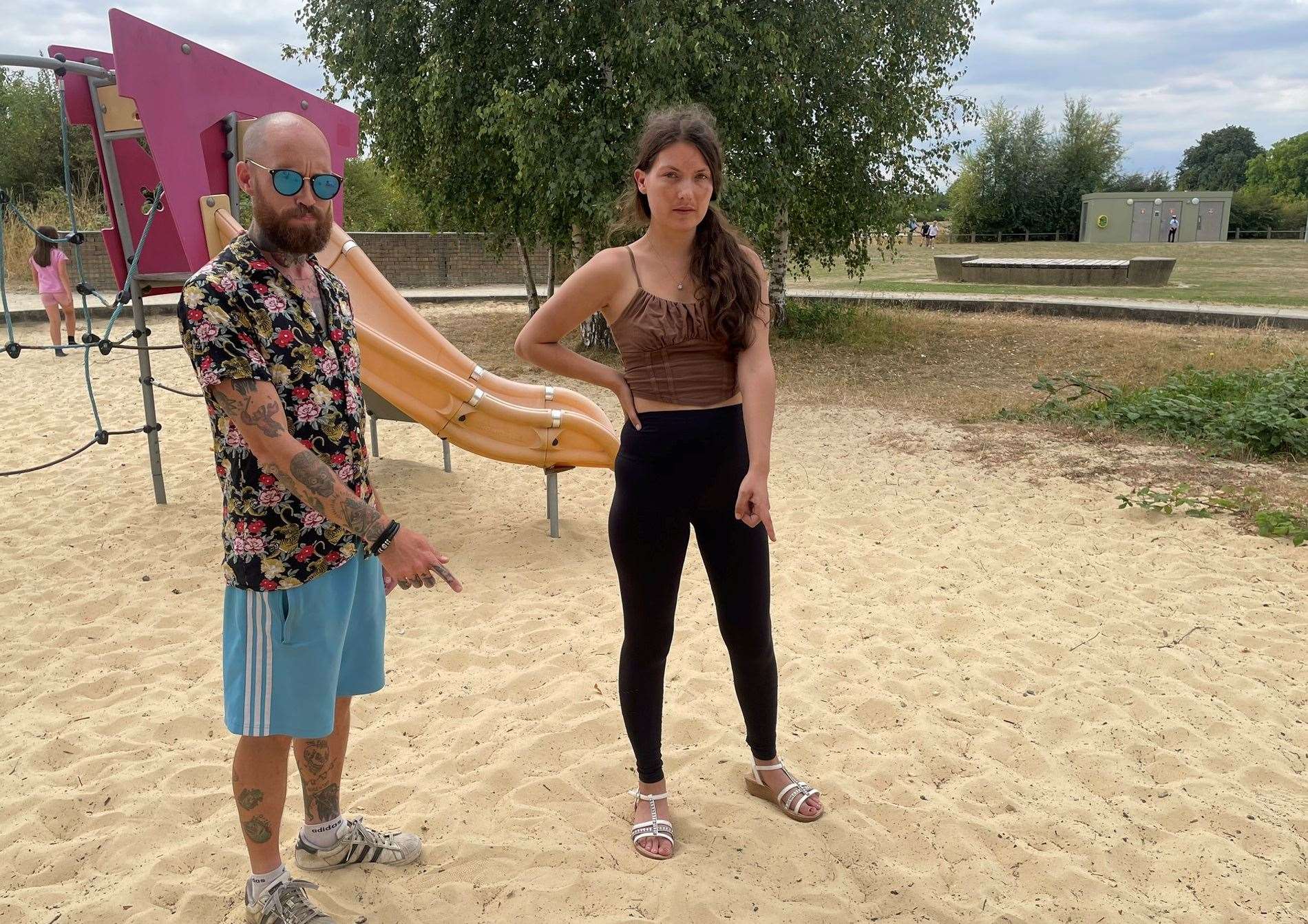 Sittingbourne parents Nelson Osborne and Zoe Bonner point to the spot where their children found a knife in Milton Creek Country Park sandpit. Picture: Joe Crossley