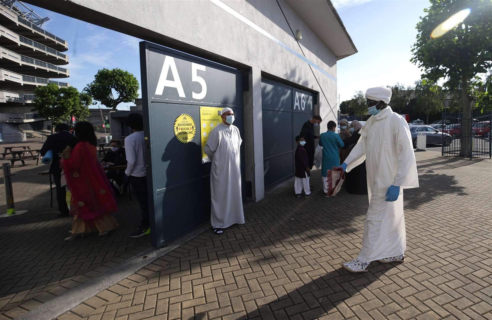 A worshipper in PPE arrives at Croke Park, Dublin (Damien Eagers/PA)