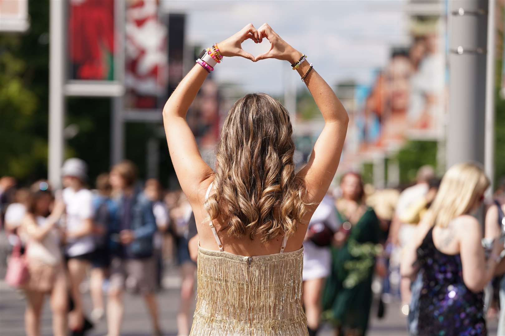 A Taylor Swift fan poses for a photo outside Wembley Stadium in London (Lucy North/PA)