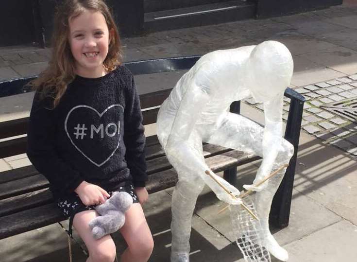 Maddison, aged 8, was amazed by the sellotape man so wanted her picture taken with him