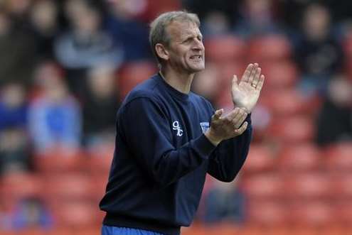 Assistant boss John Schofield shouts encouragement from the sidelines