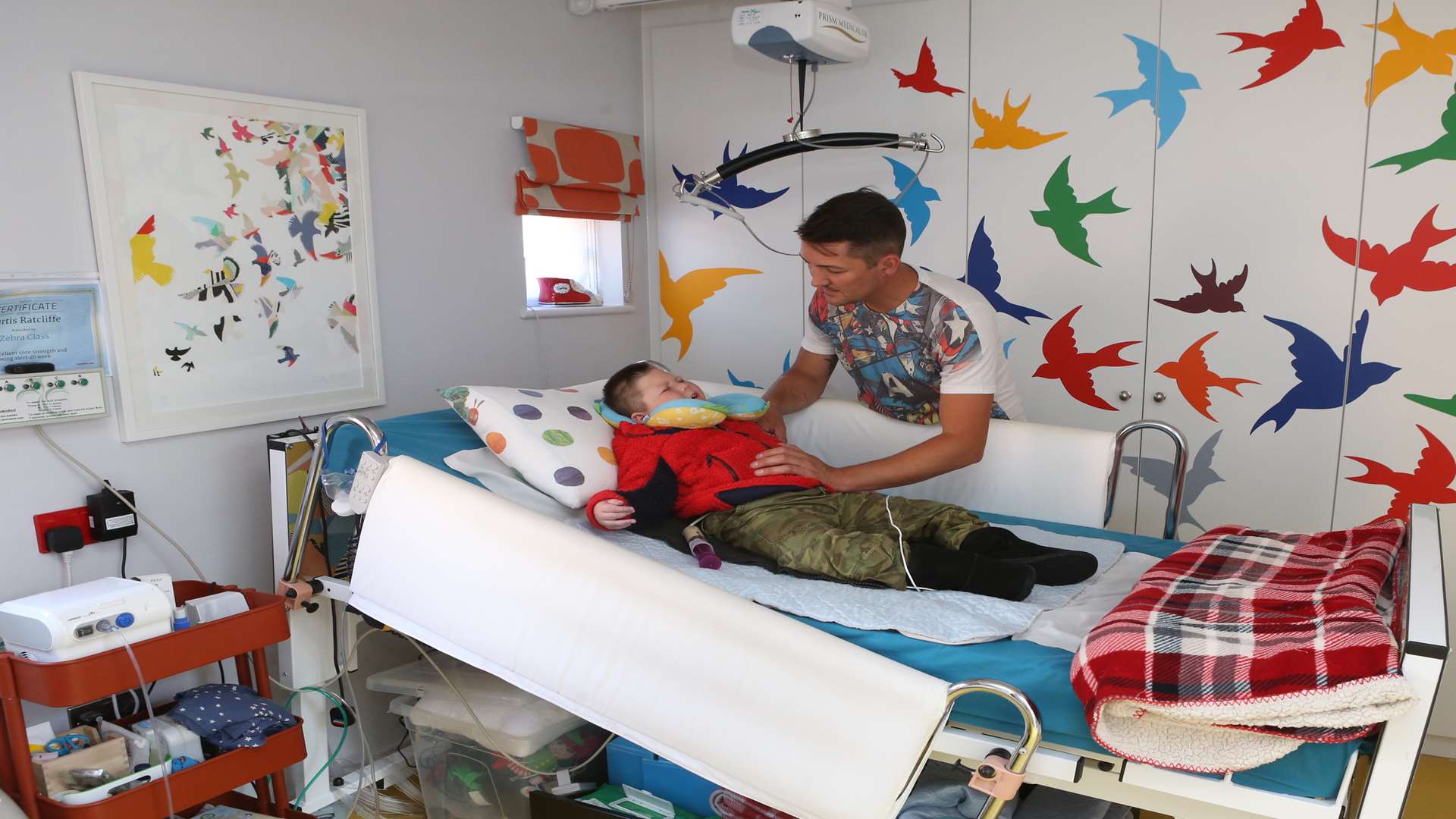 Kyle Ratcliffe demonstrates some of the lifts and hoists and state of the art electronics in one of the bedrooms.