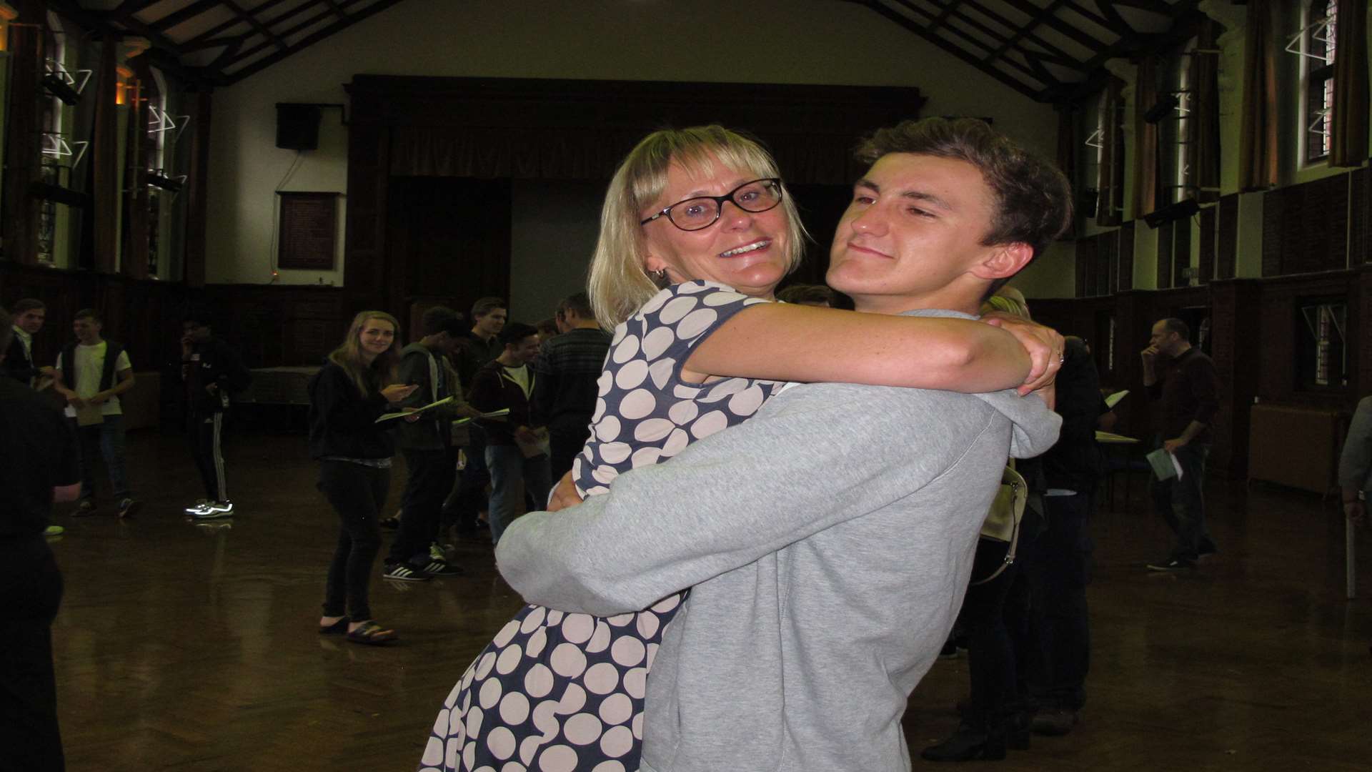 Dom Smith hugs mum Sue who screamed loudly when she heard his results