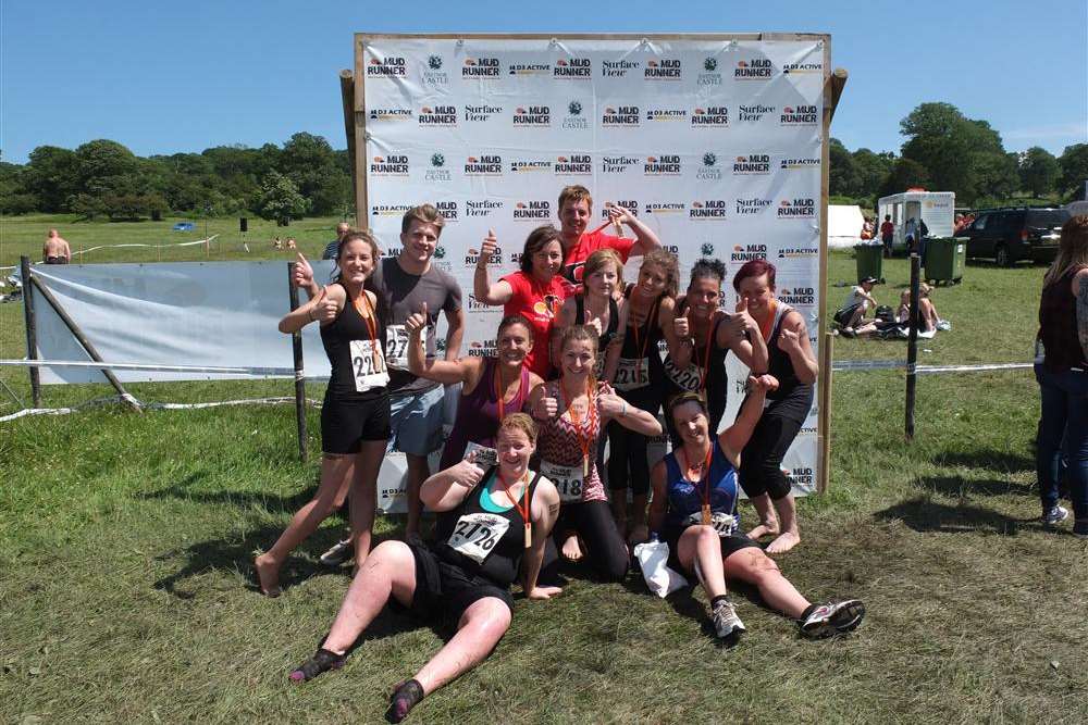 Staff and parents from Dimples Day Nursery after their Mud Run