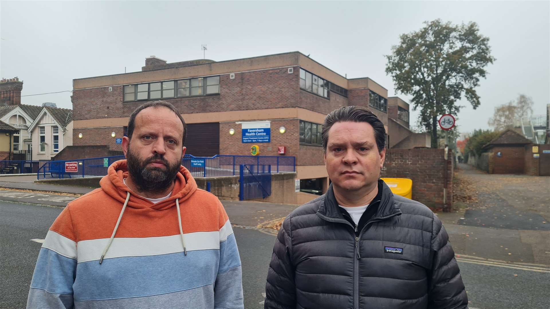 Residents Neil Stephens (left) and Chris Hamilton fear the mobile mast on top of Faversham Health Centre will be a monstrosity